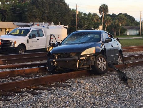 Freight train hits car in Gifford