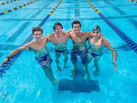 Four swimmers carry St. Ed’s banner at regionals