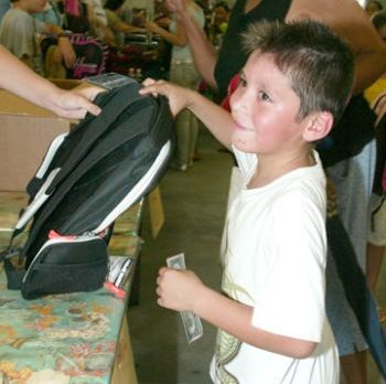 700 kids get new backpacks at Fellsmere’s Operation Hope