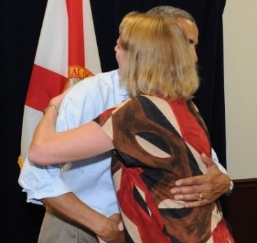 Women’s club leader got her own Obama hug