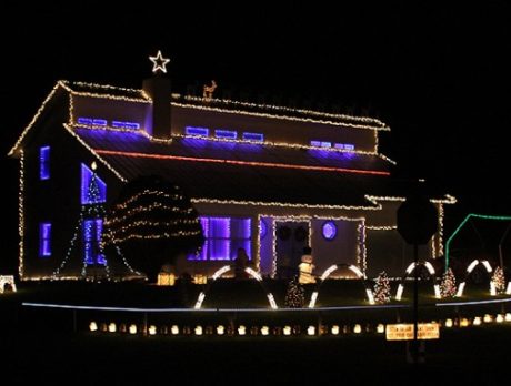 Houses and businesses decorate for the holiday season