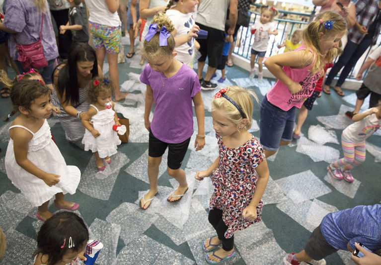 PHOTOS: Kids prove Bubble Wrap Explosion is tops for pops