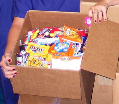 Local kids support US troops by giving up their Halloween candy