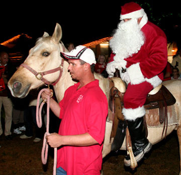 Santa comes riding into town on horseback at LaPorte Farms