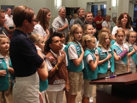 Girls Scouts help with Pledge of Allegiance