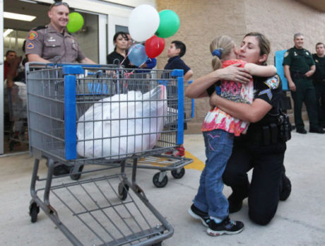 Shop with a Cop helps 150 kids shop for friends, family