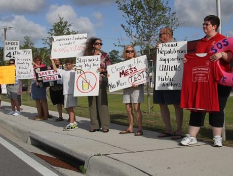 Protestors line SR 60 to welcome Gov. Scott