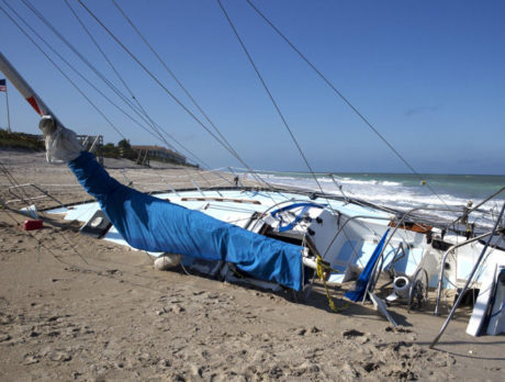 Derelict sailboat finally being moved from beach