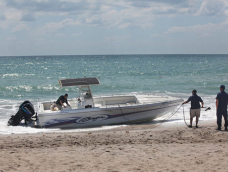 Customs, police check out beached boat near Seaquay in Vero Beach