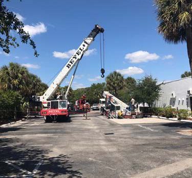 Crane drops into hole in Portales de Vero parking lot