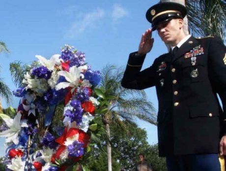 Flag-waving crowd pours onto Memorial Island to commemorate fallen heroes