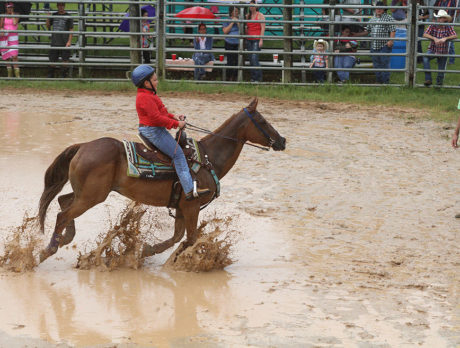 Youth honor past riders in muddy, rainy day of rodeo