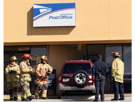 Car crashes into Post Office lobby