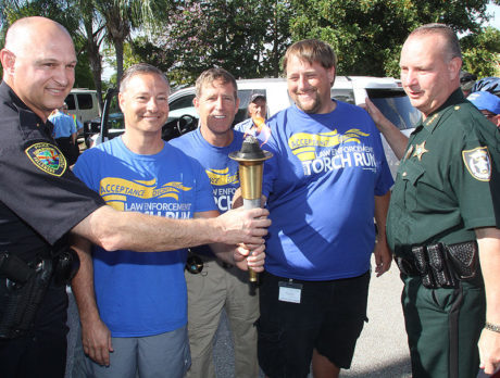 Local “heroes” run through Vero with Special Olympics torch
