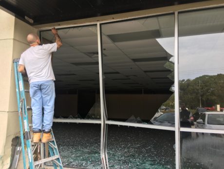 No injuries after car slams into vacant building in shopping plaza