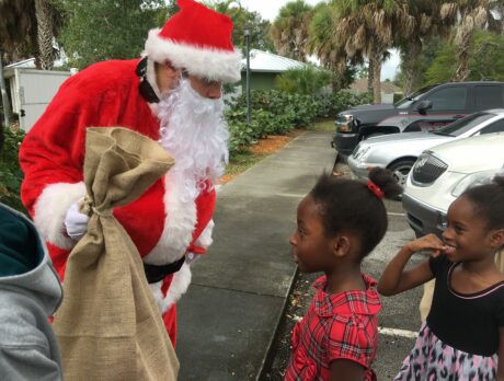 Santa, helpers give gifts to children’s center, families in need