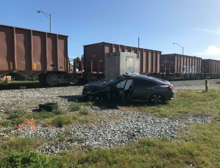 Driver, passenger ID’d who by ‘miracle’ survive collision with train