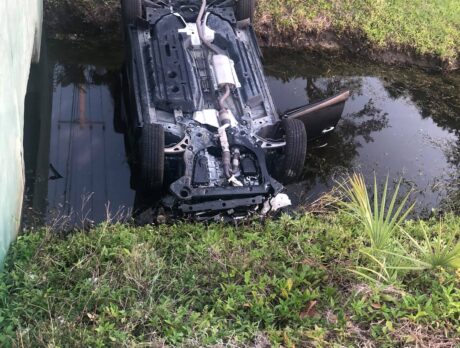 Deputies pull woman from SUV that flipped into canal