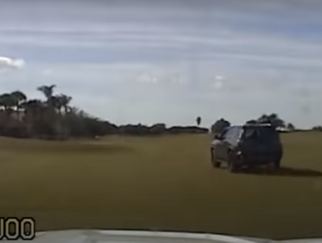 Video: Police chase ends with woman driving through Grand Harbor golf course