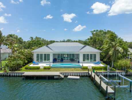 Riverfront residence features dock, saltwater pool