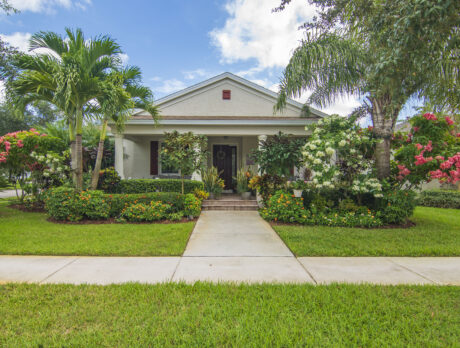 Lush landscaping enhances lovely Pointe West home